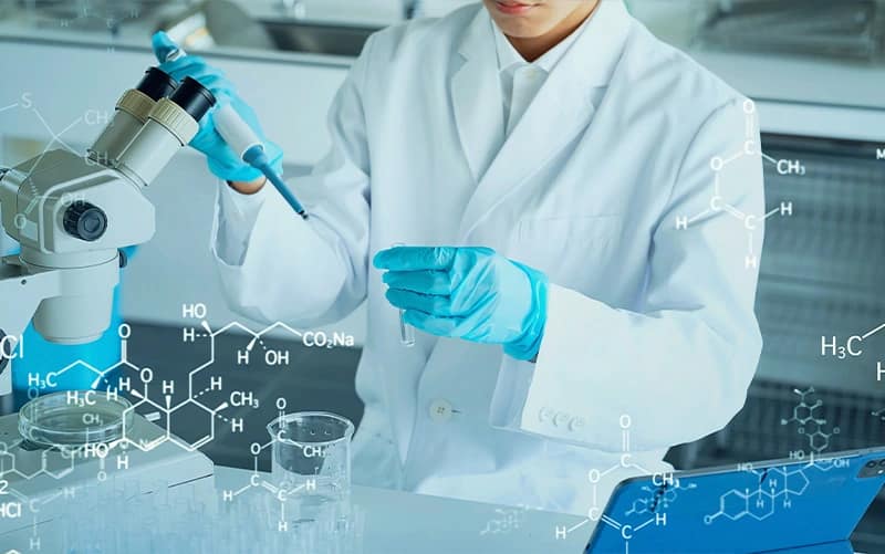 Peptide Guide 6 A woman in a lab pouring liquid into a flask