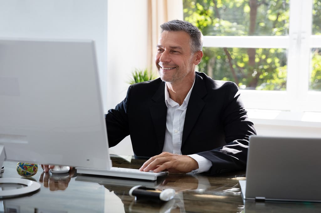 Man looking at this computer
